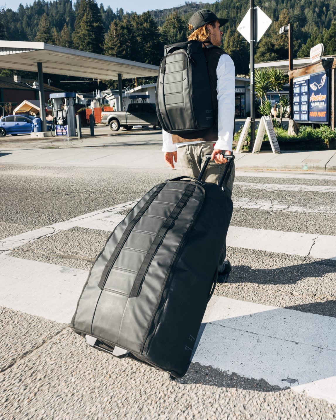 Hugger Roller Bag Check-in 90L - Black Out 