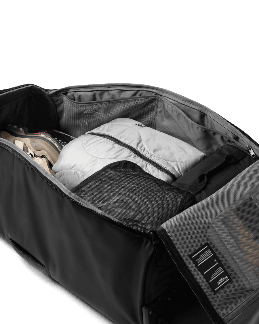 Hugger Roller Bag Check-in 90L - Black Out 